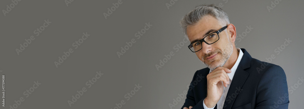 Portrait of businessman standing on grey background, isolated - template - obrazy, fototapety, plakaty 