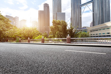 Wall Mural - empty asphalt road and modern buildings in midtown of modern city