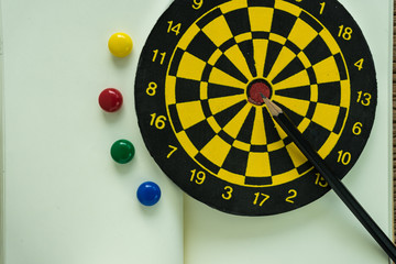Aufkleber - goals or target concept with pencil on dartboard on white paper note book