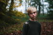© Helen Rushbrook/Stocksy - Autumnal portrait of a teenage boy.