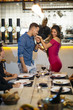 © karrastock - Proposal in the restaurant with a man asking marry to his happy girlfriend