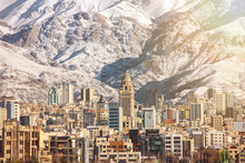 Winter Tehran  View With A Snow Covered Alborz Mountains On Background. With Lens Flare And Light Leak