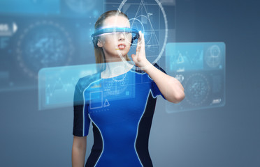 Wall Mural - woman in virtual reality 3d glasses with charts