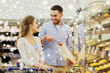 © Syda Productions - happy couple with shopping cart at grocery store