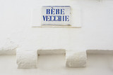 Fototapeta  - Road sign with street dialect name in a Puglia road