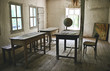 © AniQ/Stocksy - View of abandoned old school and globe on wooden table