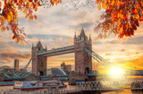 Fototapeta Londyn - Tower Bridge with autumn leaves in London, England, UK