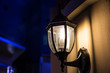 © photonewman - The wall lamp is on fire at night.