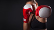 © happy_author - Female boxer with the red boxing gloves, black background with copy space
