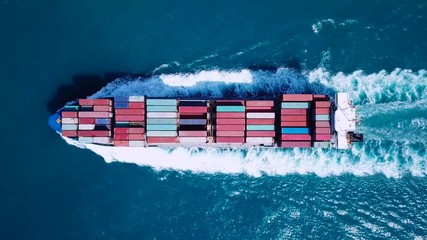 Wall Mural - Large container ship at sea - Aerial footage