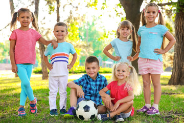 Wall Mural - Cute little children with ball in park