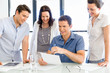 © Sergey Nivens - Group of happy young business people in a meeting