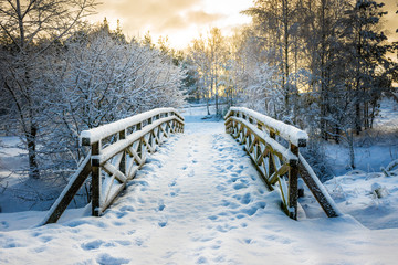 snowy, wooden bridge in a winter day. stare juchy, poland