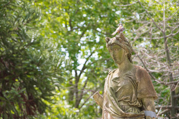 Sculpture in the park with bird