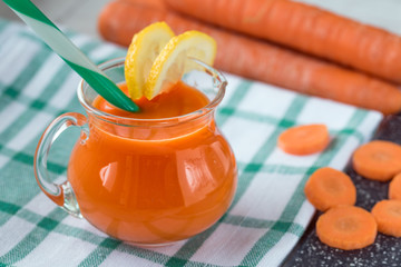 Wall Mural - Carrot juice in glass and fresh carrots. Healthy food.