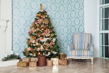 Wall Mural - Classic green tree decorated in christmas toys. Merry christmas and new year interior background.