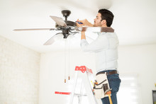 Handyman Installing A Ceiling Fan