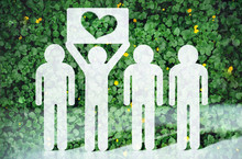 Paper People On Green Grass On Bright Background. Greenpeace, A Symbol Of The Heart From The Grass. Love And Protection Of Nature And Ecology.