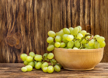 Bowl With Fresh Ripe Green Grapes On Wooden Background.