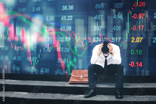 Cuadros en Lienzo Tired or stressed businessman sitting on the walkway in panic digital stock mark