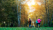 © byswat - Running athletes in the park on a run in the early morning. Several children are running in the woods doing sports. Healthy lifestyle.