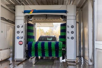 Wall Mural - Automatic car wash in action, car wash