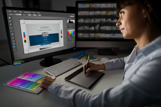 Graphic designer at work. Color samples.