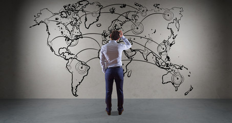 Businessman watching manuscript world map connection on a wall 3D rendering