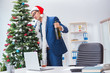 © Elnur - Businessman celebrating christmas holiday in the office