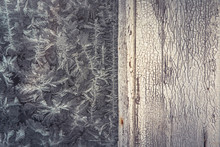 Vintage Winter Frost Background With Old Wooden Bleached Surface With Frost Pattern On Frozen Window As Christmas Background 