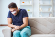 © Elnur - Young man recovering healing at home after plastic surgery nose