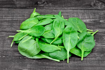 Poster - Heap of fresh green baby spinach on table