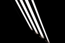 LED Fluorescent Light Tubes On Black Background. Professional Lighting Equipment For Photo Or Video Production.