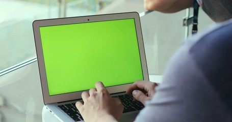 Man hands using laptop closeup green screen chroma key mockup tapping point networking communication internet surfing technology wifi male texting working browsing blank monitor pc chat online website