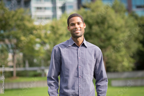 Fotografie, Obraz Portrait of young African American man in residential neighborhood in the city