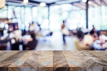 Aufkleber - Empty rustic old wood table and blurred people dining at restaurant with bokeh light background. product display template.Business presentation.
