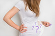 Woman with imagination of a pregnant belly - infertility concept