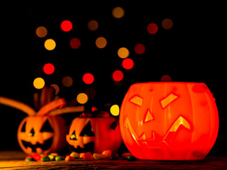 Wall Mural - Halloween pumpkin with sweets candies, scary smile. Light inside.