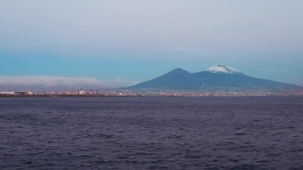 Wall Mural - Beautiful sunny day in the Bay of Naples to Vesuvius covered in winter with snow