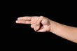 © Yutthana - Hand sign of gun, right, pointing, etc. on black background