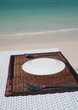 Table setting at the beach restaurant with beautiful blue sea background