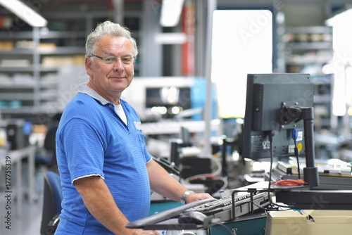 Fotografie, Obraz Portrait of smiling workers in an industrial plant