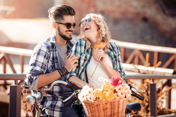 Wall Mural - Loving couple riding bikes.