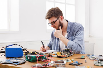 Poster - Electronic circuit board inspecting in repair shop