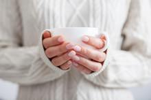 Coffee Mug In Female Hands.