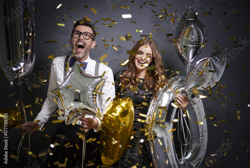 Fotografie, Obraz Screaming couple cheering while new year event
