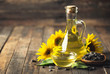 Leinwandbild Motiv Sunflower oil and seeds