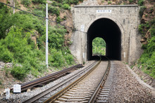 Cave In The Mountain And Railway For Train