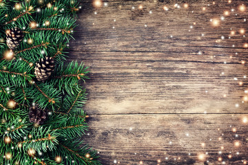 Christmas fir tree on a wooden background