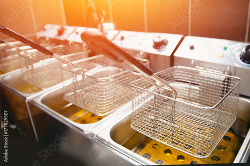Fotomural fryer for potatoes with boiling oil